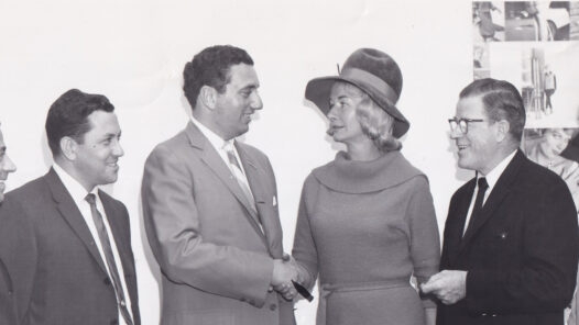 Group photo of Radio Free Europe Fund committee members meeting in Boston, 1963, planning a Radio Free Europe float for the Columbus Day Parade.