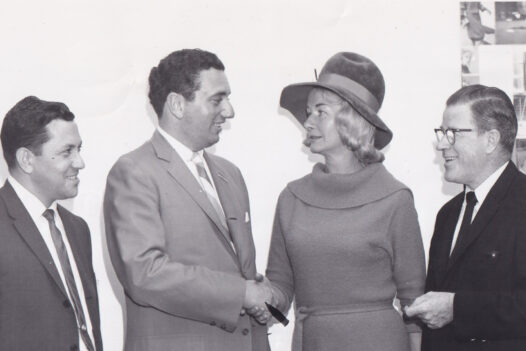 Group photo of Radio Free Europe Fund committee members meeting in Boston, 1963, planning a Radio Free Europe float for the Columbus Day Parade.