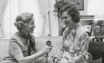 Black-and-white photograph of Pat Gates conducting a Voice of America interview with First Lady Rosalynn Carter at the White House on December 8, 1977. National Archives (NAID 177063).