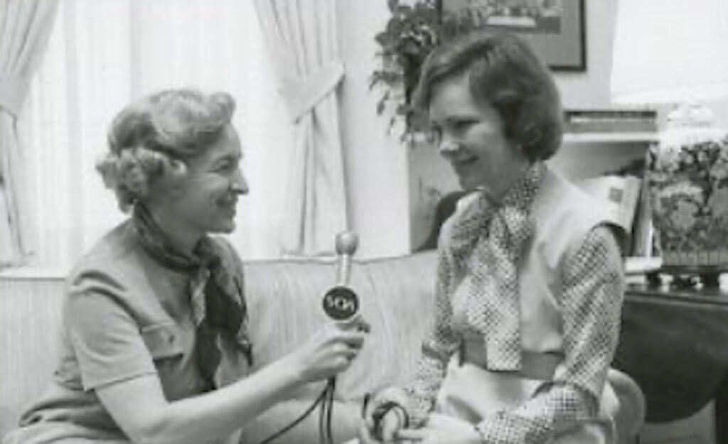Black-and-white photograph of Pat Gates conducting a Voice of America interview with First Lady Rosalynn Carter at the White House on December 8, 1977. National Archives (NAID 177063).